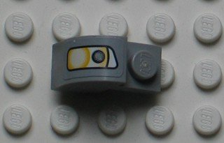 LEGO part Slope, Curved 2 x 1 x 1 1/3 with Recessed Stud with Headlight Pattern Model Right Side (Sticker) - Set 8654 (6091pb006R)
