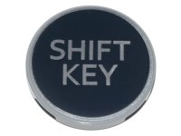 LEGO part Tile, Round 3 x 3 with Silver 'SHIFT KEY' on Black Background Pattern 67095pb009