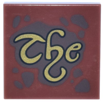 LEGO part Tile 2 x 2 with Dark Brown Spots and Splatters and Gold Script 'The' Pattern (3068pb2659)