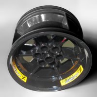 LEGO part Wheel 56mm D. x 34mm Technic Racing Medium, 6 Pin Holes with Yellow 'FIRM GRIPP' Pattern (3 Stickers) - Set 42039 15038pb02