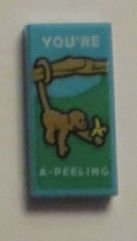 LEGO part Tile 1 x 2 with Monkey with Banana and 'YOU'RE A-PEELING' Pattern 3069pb0373